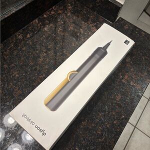 Dyson Airstrait in Gold and Onyx Black